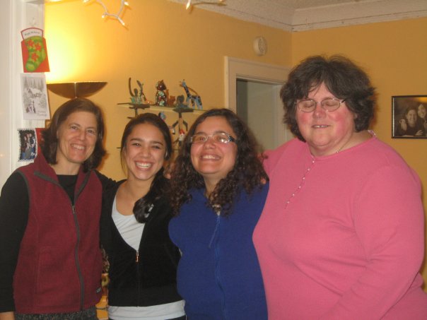 Mila standing with three other women from her homestay family